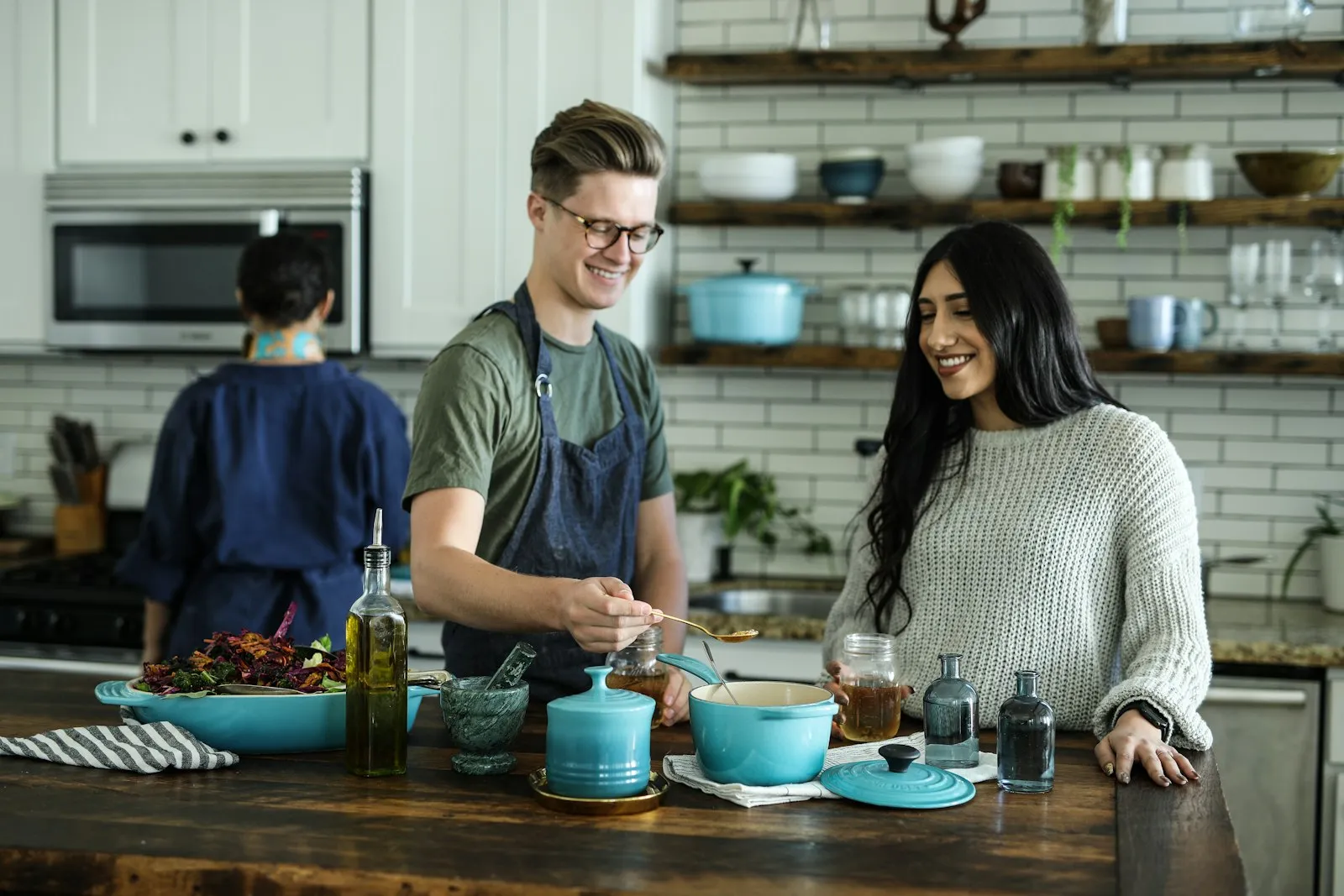 People cooking together at a kitchen counter